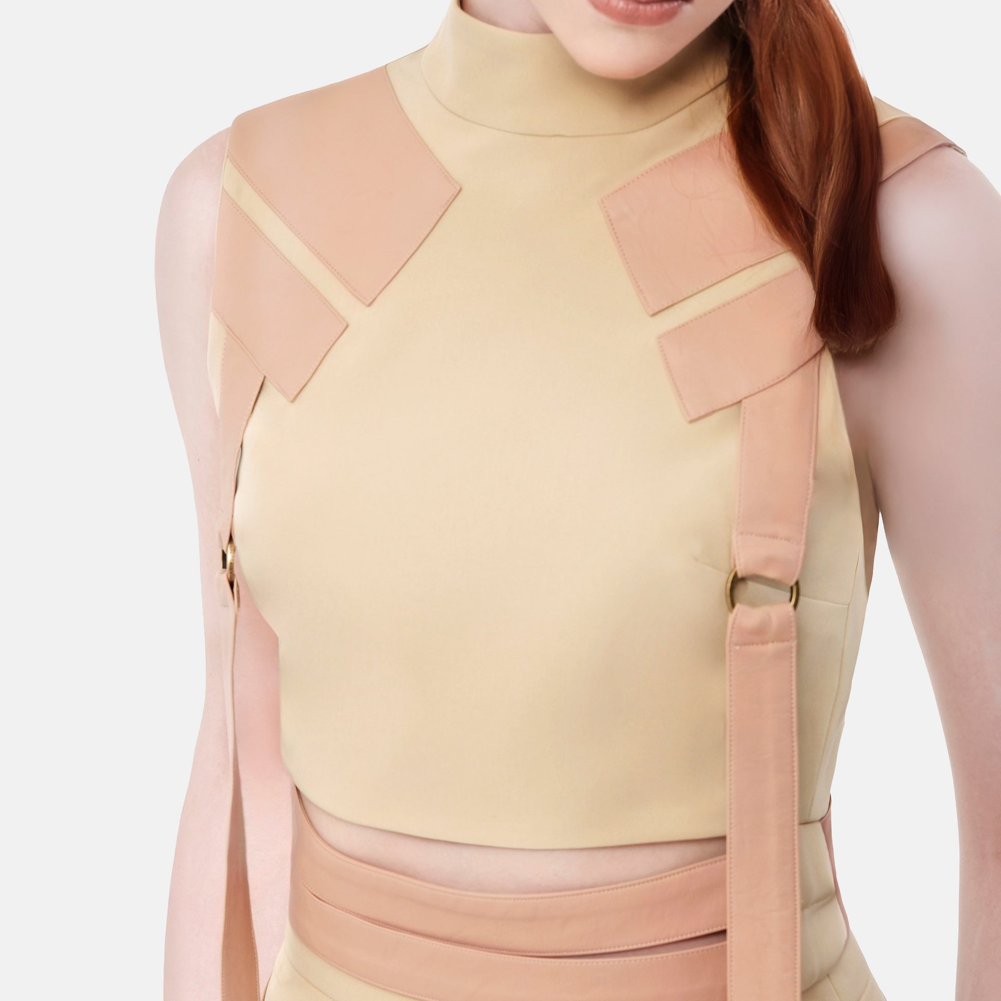 FlyandFall beige top detail showing modern structured panels and clean craftsmanship in neutral beige tone.