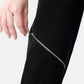 FlyandFall Astra pants zipper detail in metallic finish, sleek modern women’s fashion design.