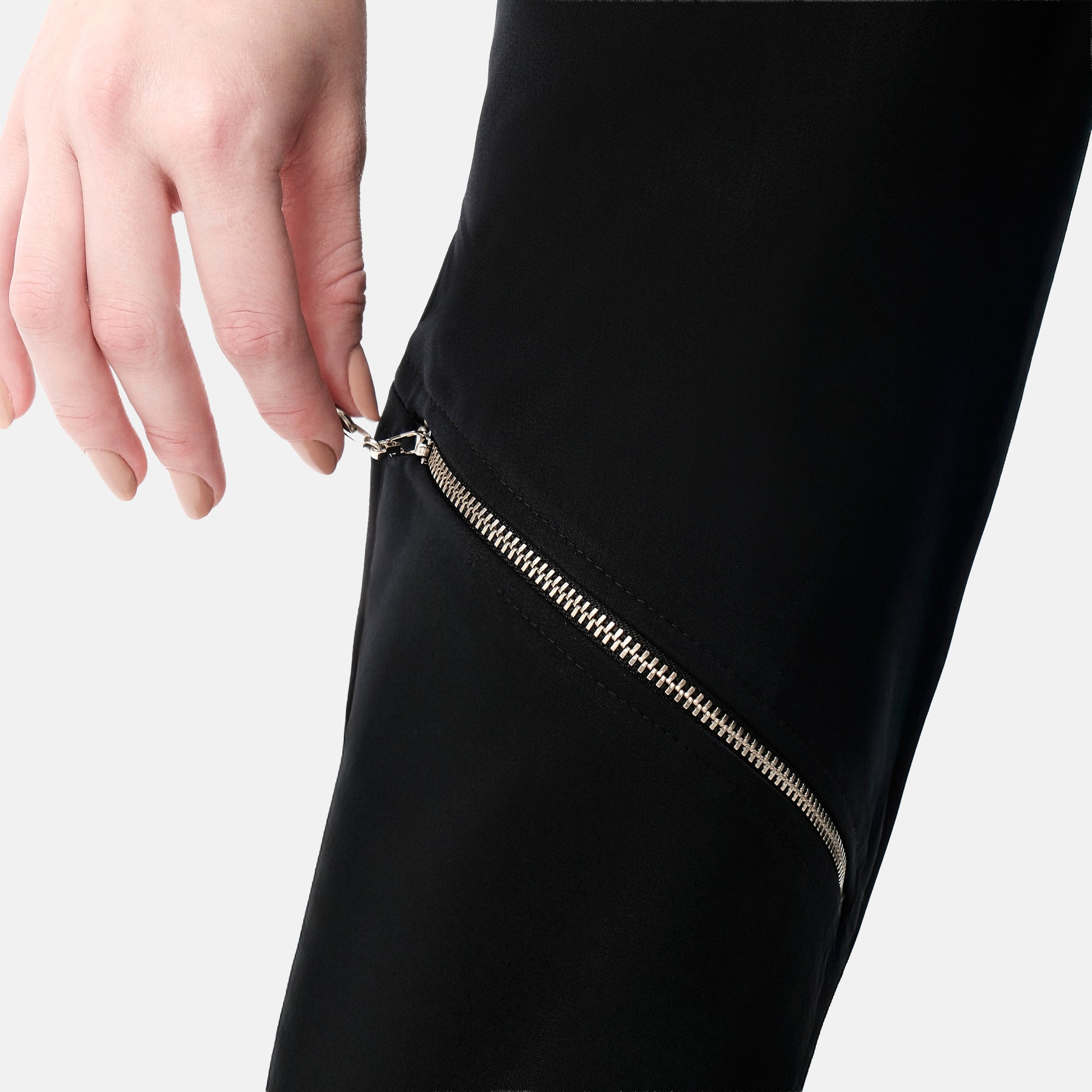 FlyandFall Astra pants zipper detail in metallic finish, sleek modern women’s fashion design.