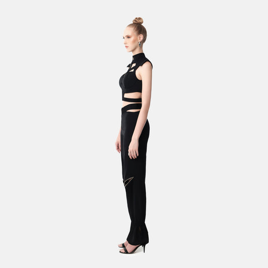 FlyandFall Astra black crop top and pants set side view, structured silhouette with geometric cutouts.