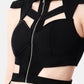 ASTRA black cutout crop top with geometric straps and front silver zipper detail