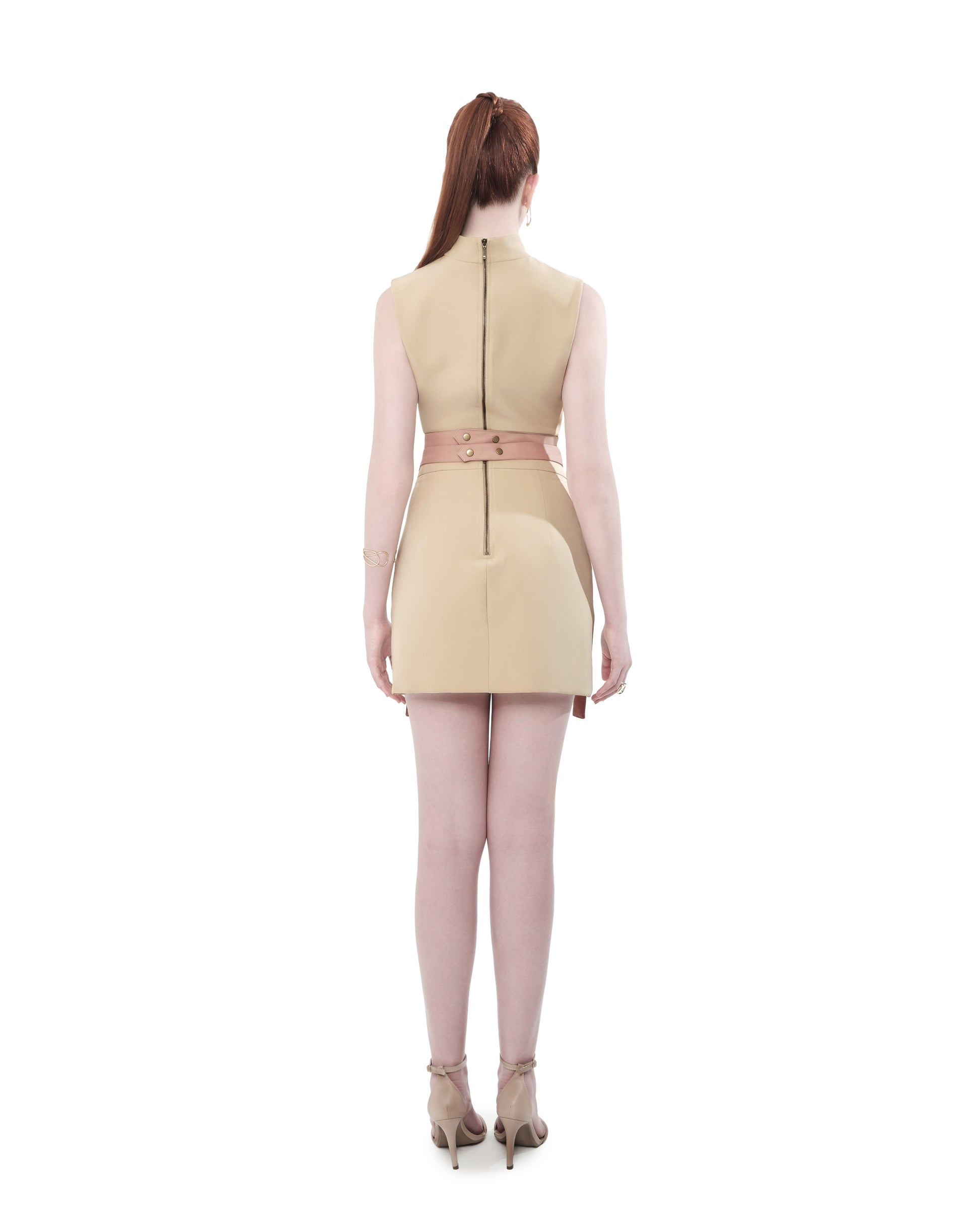 Back view of FlyandFall's structured mini skirt and sleeveless top, with center zip and soft shaping.