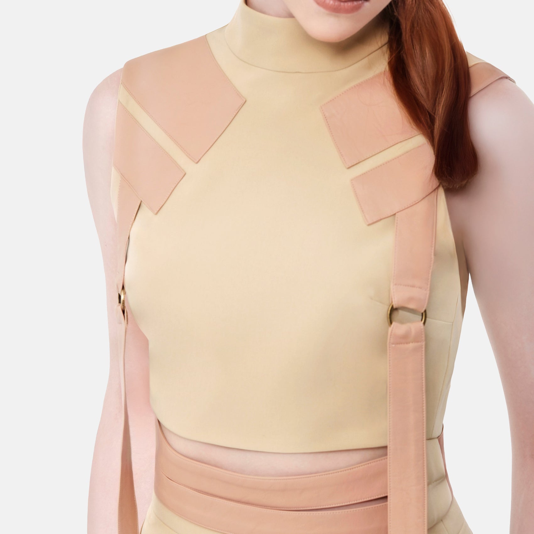 FlyandFall beige top detail showing modern structured panels and clean craftsmanship in neutral beige tone.