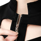 Close-up of FlyandFall black crop top zipper neckline with structured cutout details