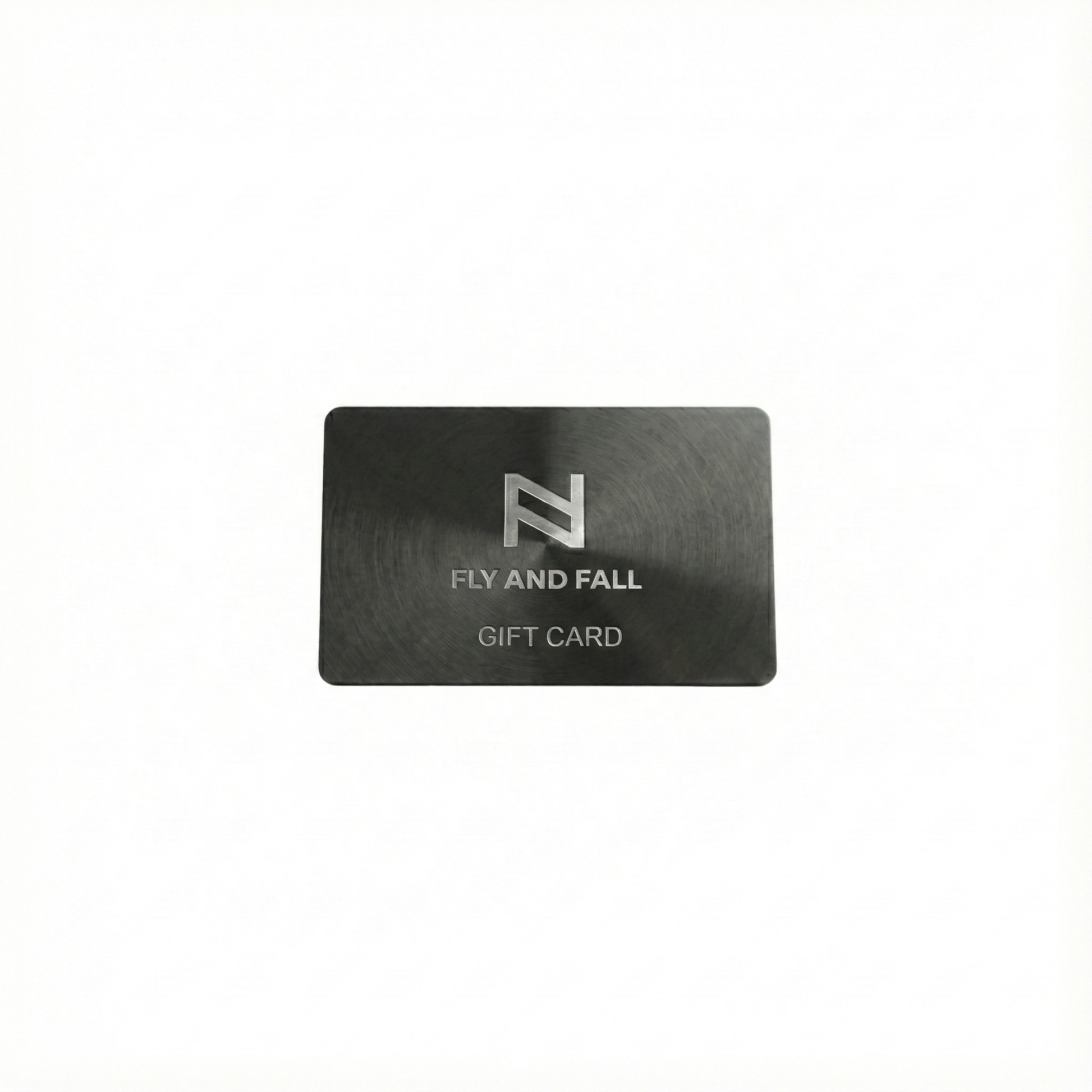 FlyandFall luxury digital gift card with metallic logo on dark brushed background.