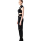 Side angle highlighting FlyandFall’s asymmetric crop top and flared pants with bold zipper details.