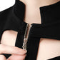 Tight view of the collar zipper from FlyandFall’s crop top, emphasizing futuristic design and finish.