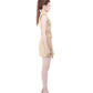 Side profile of FlyandFall's beige mini skirt set with belt details and clean tailored silhouette.