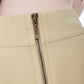 Macro of FlyandFall’s back zipper on the high-neck top, emphasizing construction and finish.