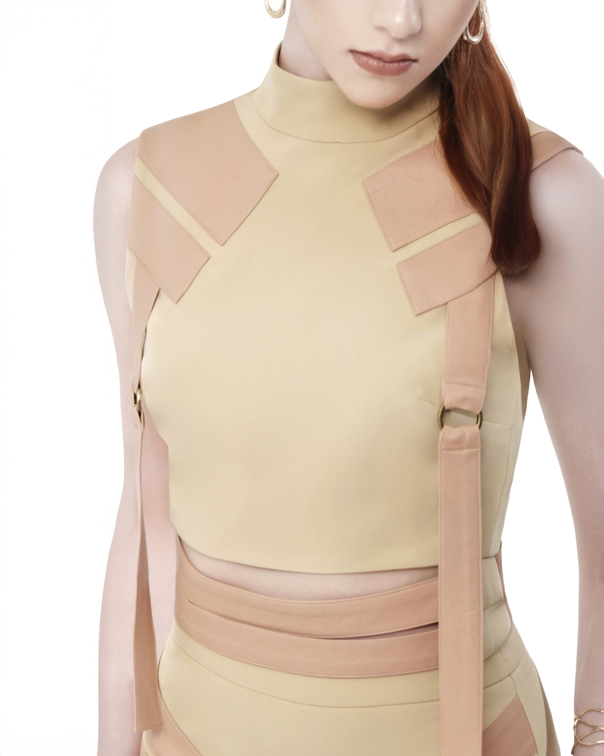 FlyandFall beige top featuring angular panel design and mock neck, captured from upper torso.