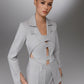 KAEL gray deconstructed cutout suit front view showing interlocking button tabs layered blazer panels and tailored pockets