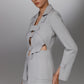KAEL gray deconstructed cutout suit side front view showing layered blazer panels fabric covered buttons and tailored front pocket