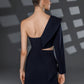 Back view of NERIS dark blue asymmetric cutout dress showing the open shoulder, layered lapel and waist cutout