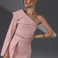 NERIS Lotus Pink asymmetric cutout dress showing the one-shoulder folded detail, waist cutout and tailored button details