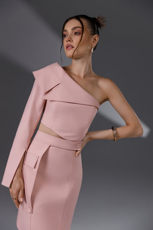 NERIS Lotus Pink asymmetric cutout dress showing the one-shoulder folded detail, waist cutout and tailored button details