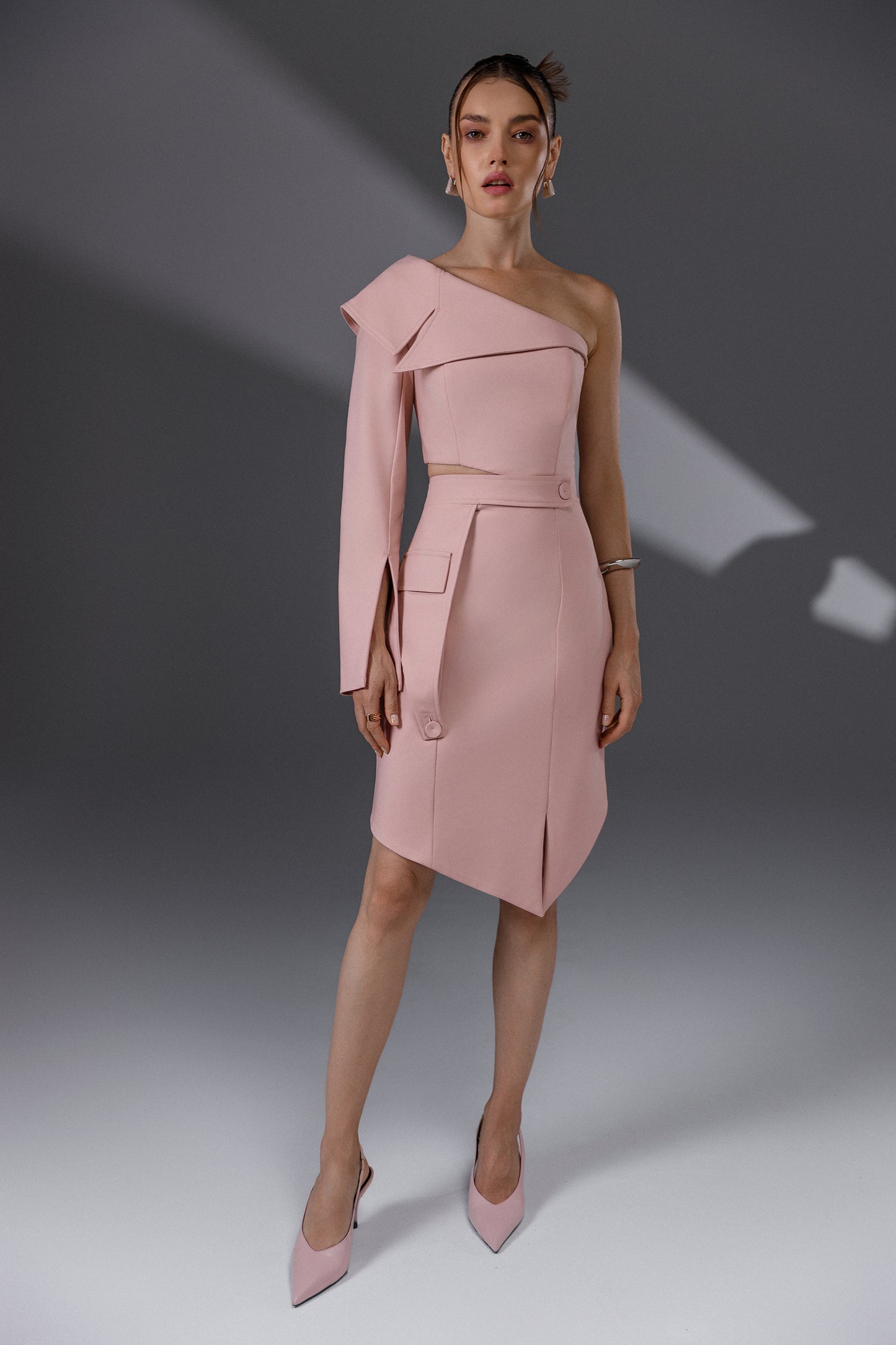 NERIS Lotus Pink asymmetric cutout dress front view with one-shoulder design and asymmetric hem