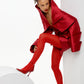 Obsidian Bloom red Mikado editorial dress in sculptural seated pose with dramatic high collar and architectural sleeves by FlyandFall