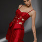 SCORIA red Mikado editorial dress with sculptural waist lacing and geometric cutouts by FlyandFall