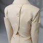 SOLEN sand beige cropped jacket and asymmetric skirt back detail with fabric covered buttons