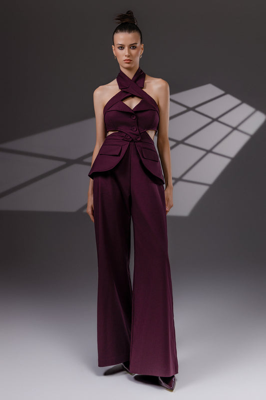 VEYRA Burgundy Crossover Halter Jumpsuit full-length front view with crossover halter neckline, waist cutouts and wide-leg trousers.