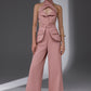 VEYRA Dusty Rose Crossover Halter Jumpsuit full-length front view with crossover halter neckline, waist cutouts and wide-leg trousers.