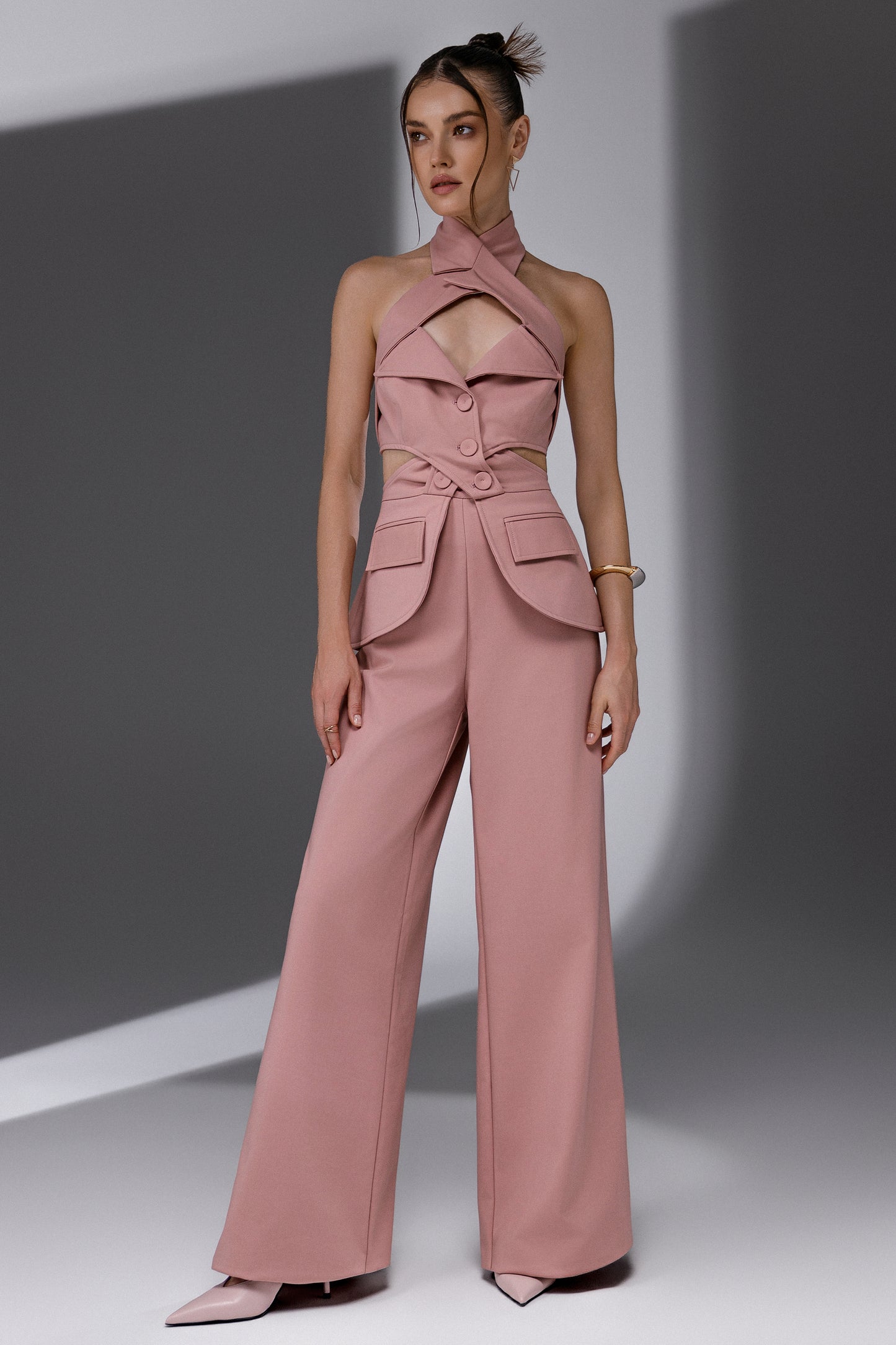 VEYRA Dusty Rose Crossover Halter Jumpsuit full-length front view with crossover halter neckline, waist cutouts and wide-leg trousers.