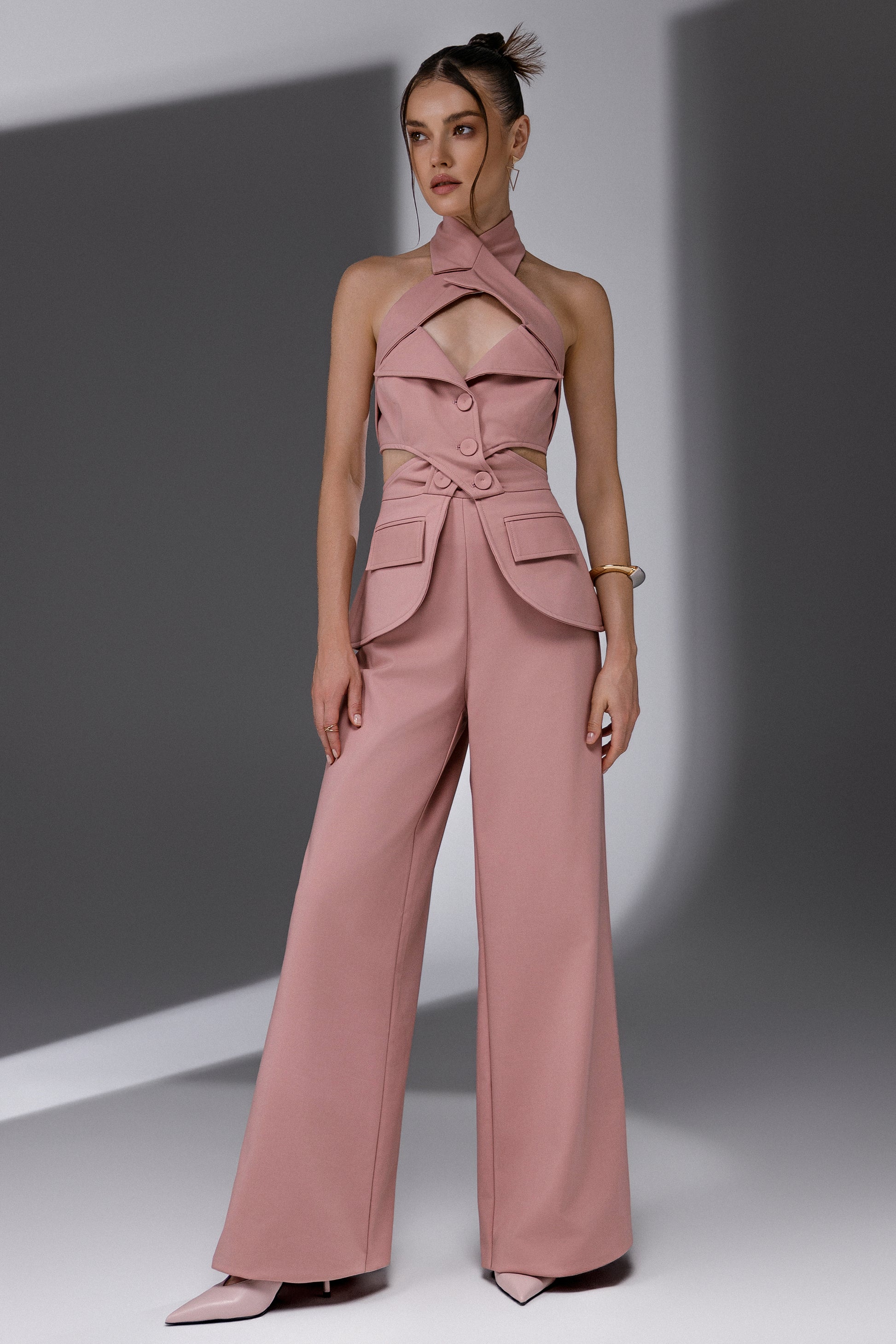 VEYRA Dusty Rose Crossover Halter Jumpsuit full-length front view with crossover halter neckline, waist cutouts and wide-leg trousers.