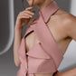 VEYRA Dusty Rose Crossover Halter Jumpsuit close-up showing the crossover halter neckline, structured collar and front cutout.